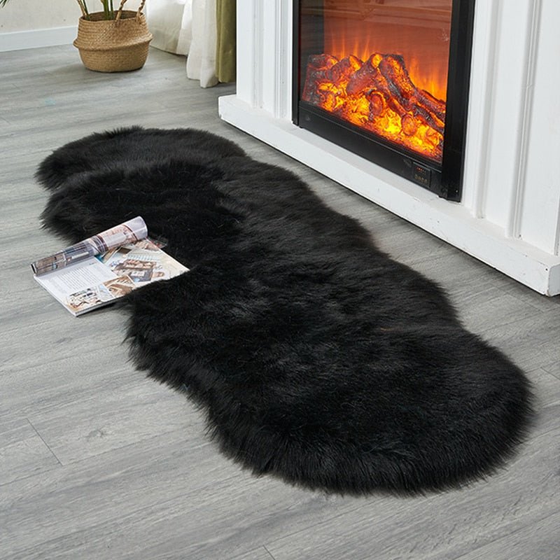 Shaggy black sheepskin style floor rug