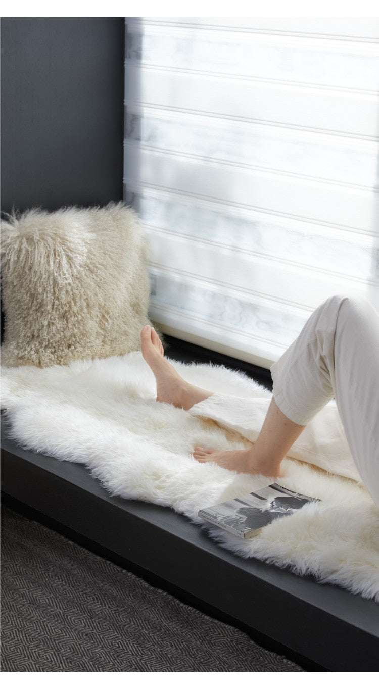 White shaggy sheepskin rug or chair mat